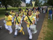 The Hough Elementary School after school program Youth Escola de Samba drum and march together during the Children's Cultural Parade at Fort Vancouver National Historic Site on Friday, May 11, 2018. The National Park Service, the Evergreen School District, and the Vancouver School District came together for the annual event to support local students and celebrate the region's historical diversity.