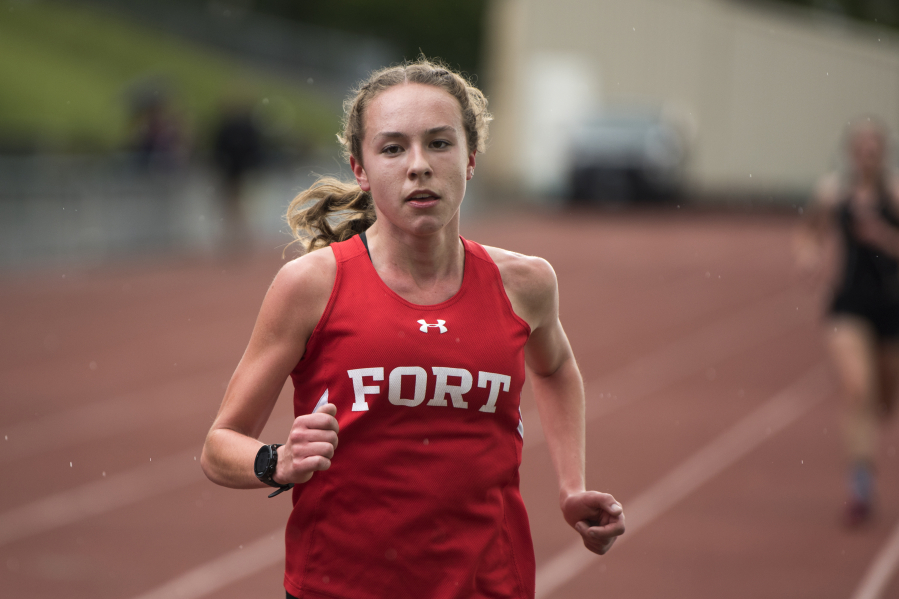 Fort Vancouver’s Emily Phelps competes in the 3,200-meter run during the second day of the 4A, 3A district track and field meet at McKenzie Stadium in Vancouver on Thursday, May 10, 2018. Phelps placed first with a time of 11:15:46.