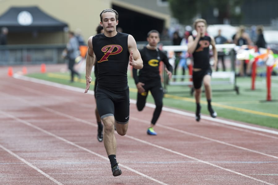 Prairie’s Nolan Mickenham crosses the finish line during the 200-meter run at the second day of the 4A, 3A district track and field meet at McKenzie Stadium in Vancouver on Thursday, May 10, 2018.