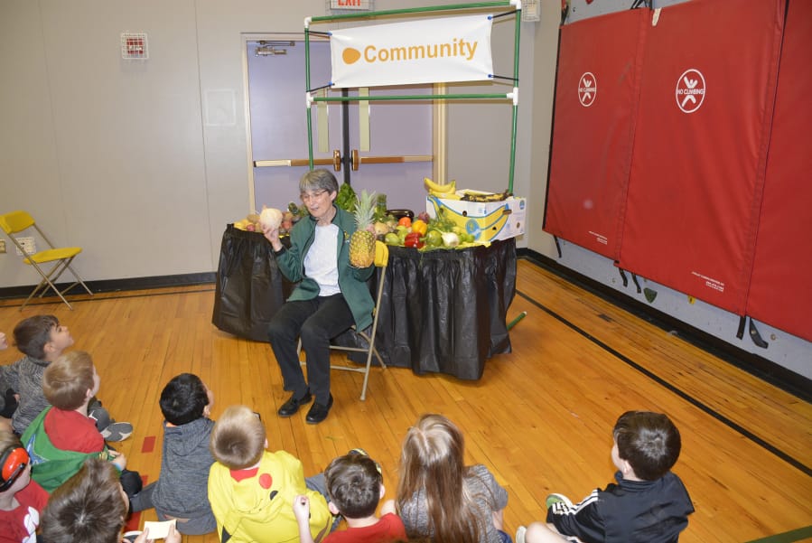 Washougal: Sharon Whalen, with Duck Delivery Produce in Portland, teaches Hathaway Elementary School students about fresh produce as part of the school’s Student Well-Being Fair.