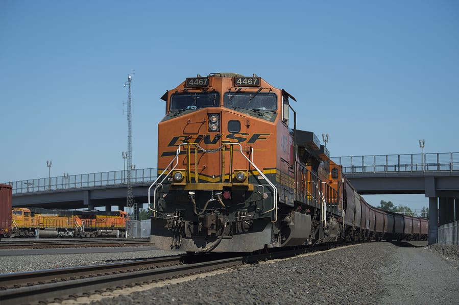 A train hauling grain rests at BNSF’s Vancouver rail yard.