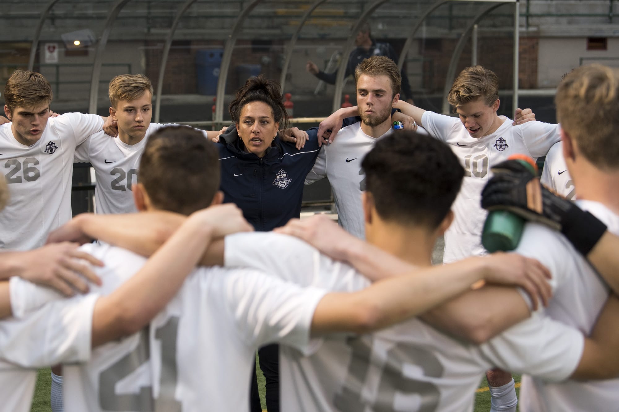 Skyview coach Colleen McKinney talks with her players at halftime during the first round of the Class 4A state playoffs at Kiggins Bowl in Vancouver on Wednesday, May 16, 2018. Skyview lost 4-1.