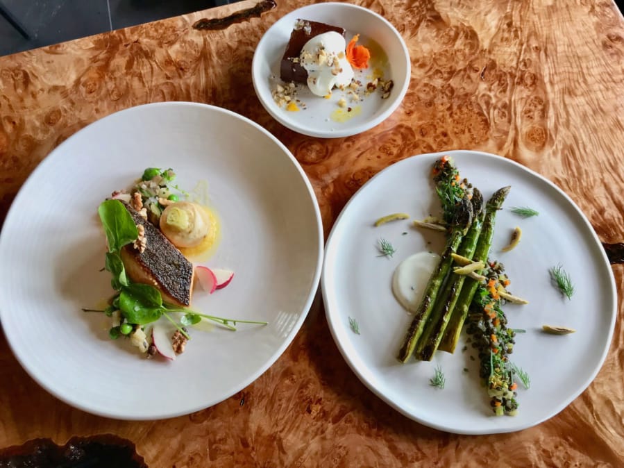 Warm asparagus with yogurt, olive, lentil and dill; salmon with turnips, peas, watercress and walnuts; and hearth baked valrhona ganache with creme fraiche and hazelnuts.