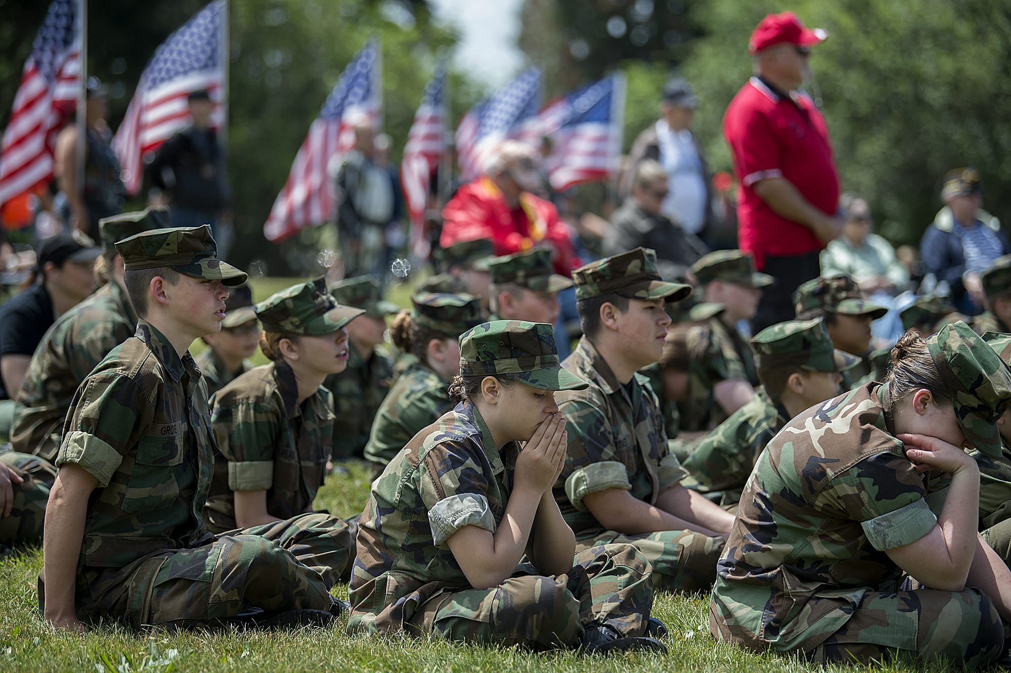 Jillian Massey, 12, of the Marine Cadets pauses for a quiet moment during the annual Memorial Day Observance at Fort Vancouver National Historic Site on Monday morning, May 28, 2018.