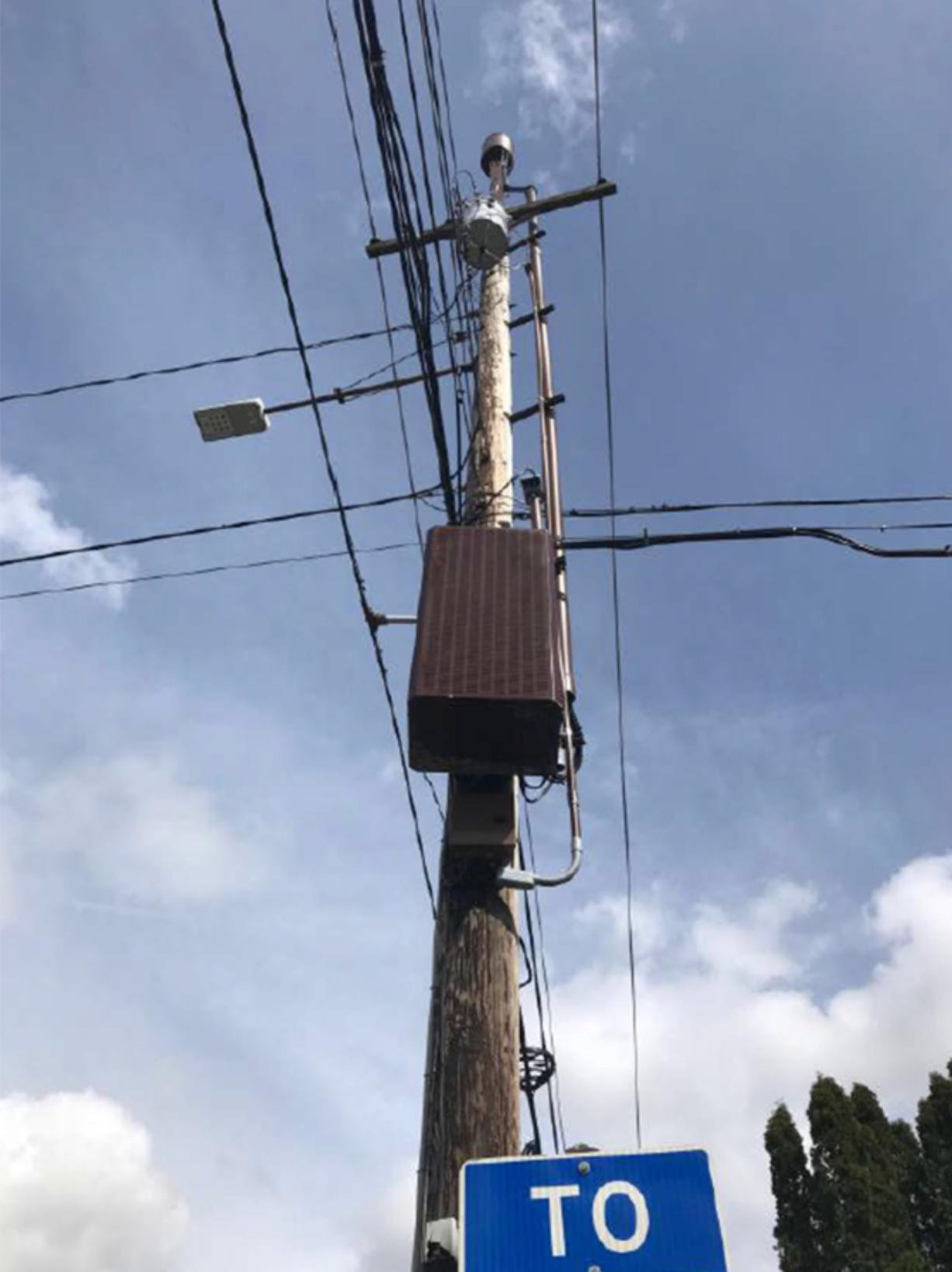 An example of how small cell equipment could look. A box on the pole contains part of the equipment, while the antennas are mounted at or near the top.