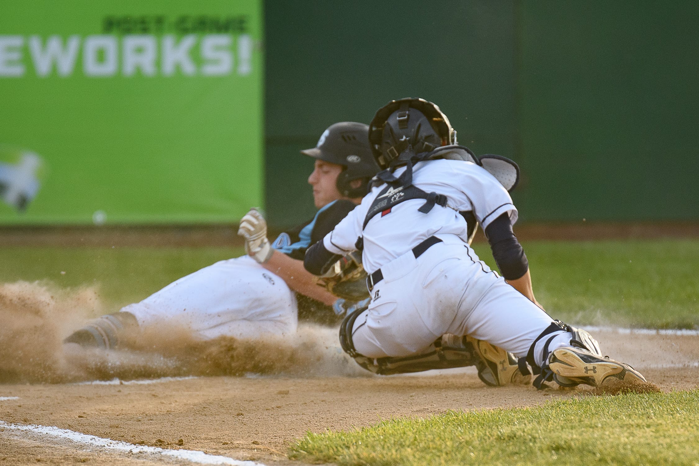 Freeman's Desmond Parisotto slides in safely ahead of the tag by King's Way Christian catcher Hunter Aarhus during the Class 1A state championship game Saturday in Yakima.