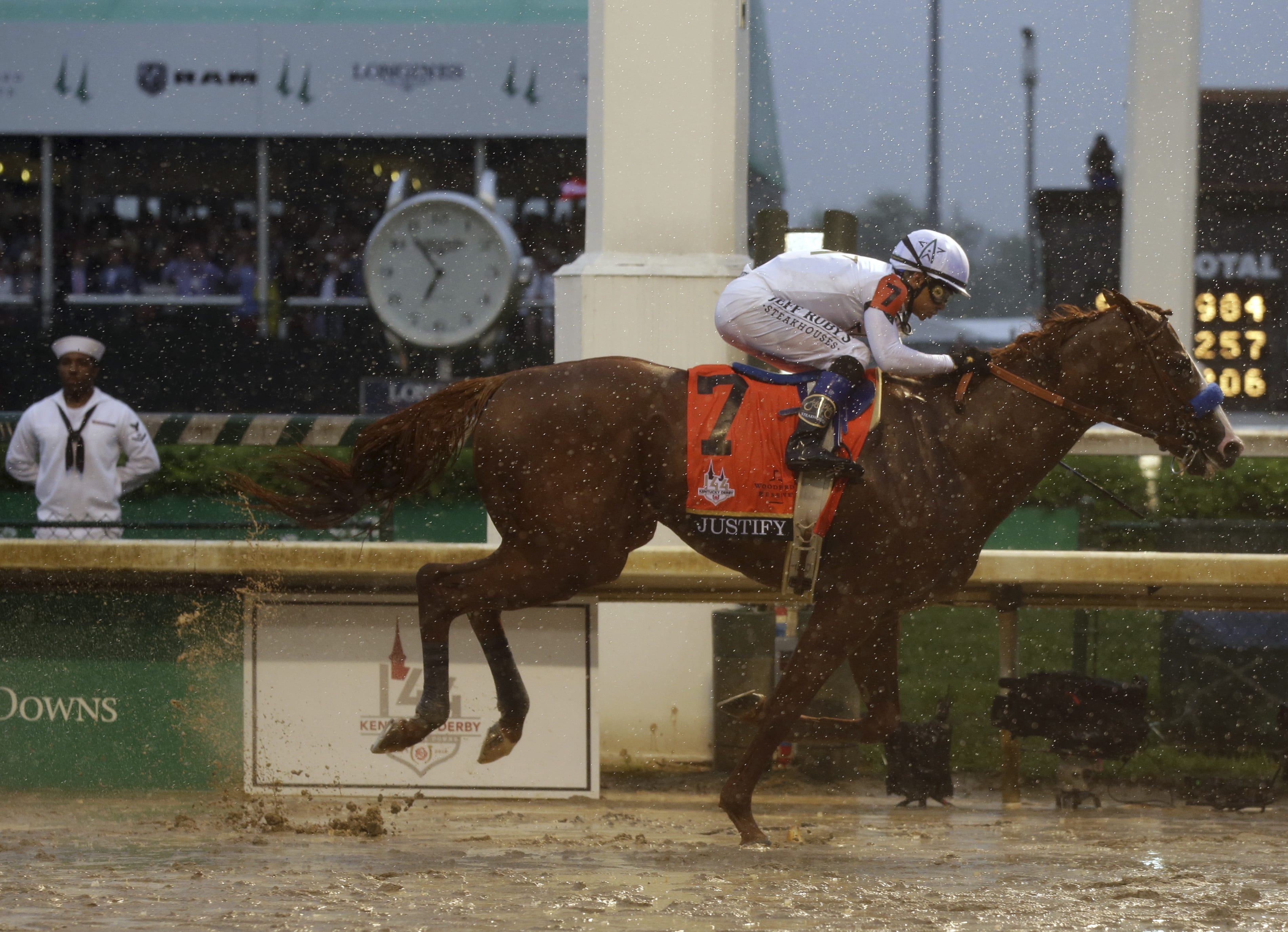 Mike Smith rides Justify to victory during the 144th running of the Kentucky Derby horse race at Churchill Downs Saturday, May 5, 2018, in Louisville, Ky.