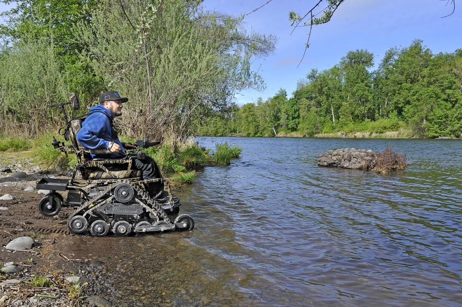 Casey Moore tests out an all-terrain wheelchair May 9 at TouVelle State Park in Jackson County, Ore. Moore is the latest of more than a dozen people with spinal-cord injuries who are able to get outdoors thanks to David’s Chair, the legacy of a Medford man who refused to allow a debilitating disease keep him from enjoying the outdoors.