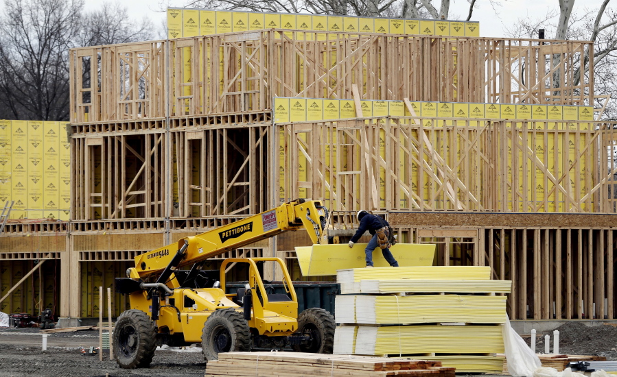 FILE- In this Feb. 26, 2018, file photo, work continues on a new development in Fair Lawn, N.J. On Tuesday, May 15, the National Association of Home Builders/Wells Fargo releases its May index of builder sentiment.