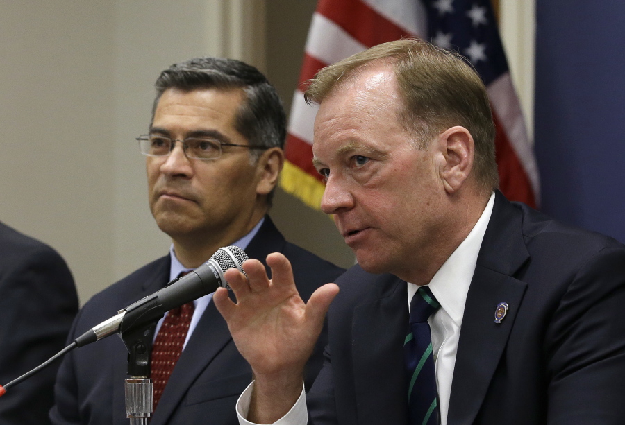 McGregor Scott, right, the United States Attorney for the Eastern District of California, accompanied by California Attorney General Xavier Becerra, discusses an increase in the use of a banned pesticide at illegal marijuana farms hidden on public lands Tuesday, May 29, 2018, in Sacramento, Calif. Researchers found the highly toxic pesticide Carbofuran, which can’t legally be used in the Unites States, at 72 percent of grow sites last year, up 15 percent from 2012.
