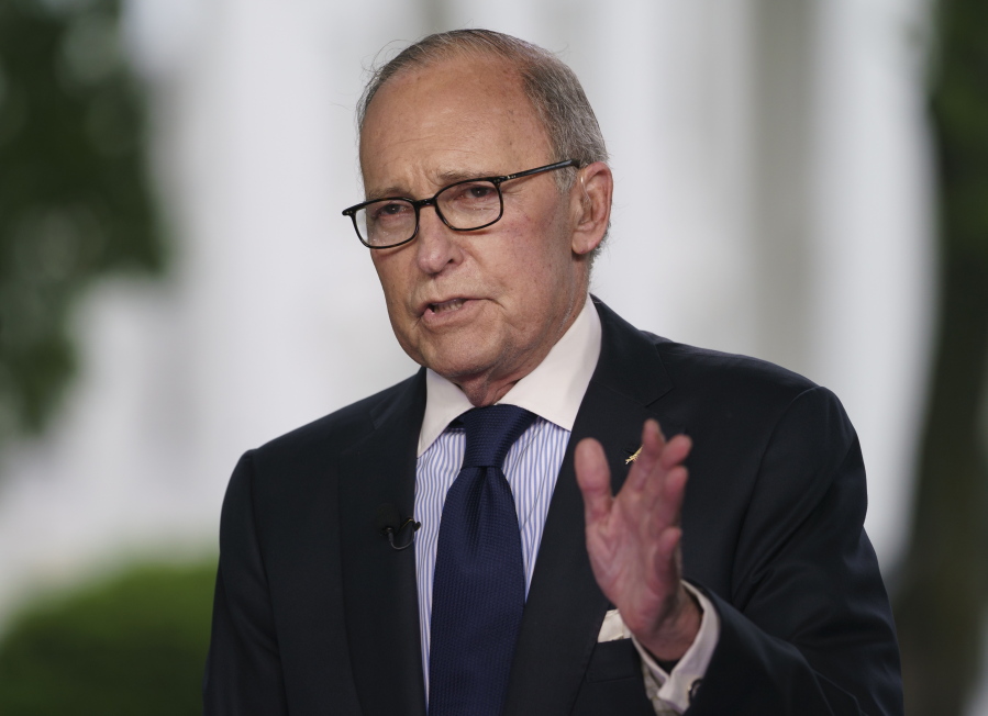 White House chief economic adviser Larry Kudlow speaks Friday during a television interview outside the West Wing of the White House, in Washington.