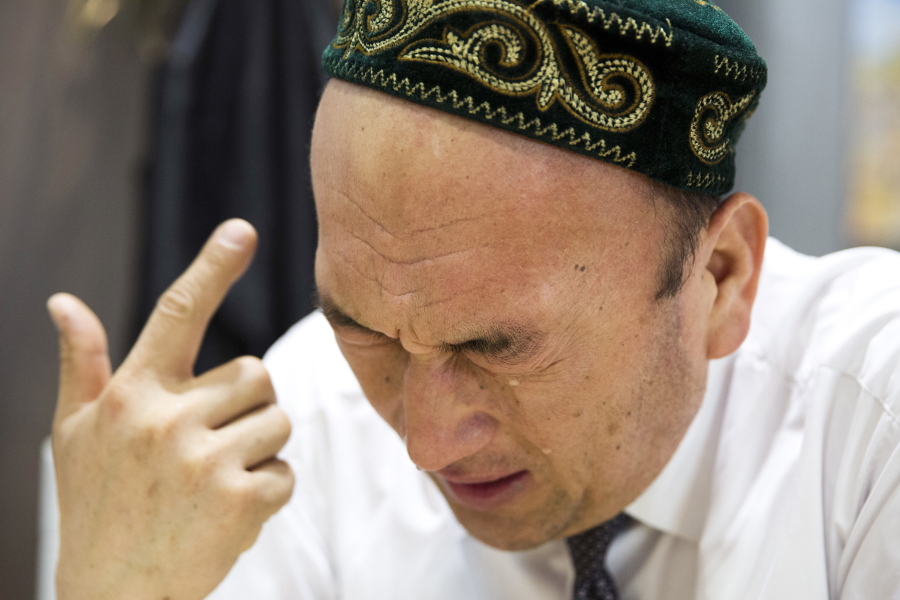 Omir Bekali cries as he details the psychological stress endured while in a Chinese internment camp during an interview in Almaty, Kazakhstan. Since 2016, Chinese authorities in the heavily Muslim region of Xinjiang have ensnared tens, possibly hundreds of thousands of Muslim Chinese, and even foreign citizens, in mass internment camps. The program aims to rewire detainees’ thinking and reshape their identities. Chinese officials say ideological changes are needed to fight Islamic extremism.