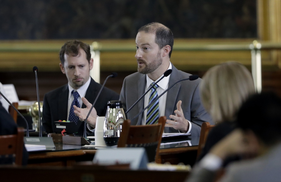 David J. Hacker, special counsel for litigation for the Texas attorney general’s office, right, and Brantley Starr, deputy first attorney general, left, take part in a committee meeting on religious freedom laws at the Texas Capitol, in Austin, Texas. Lawyers who espouse a conservative Christian agenda have been growing in influence since the Trump administration took office.