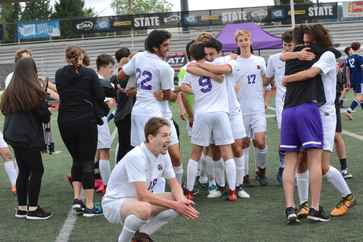 The Columbia River Chieftains celebrate in the moments after winning the 2A state title game, a 2-0 result over Burlington-Edison at Sunset Chev Stadium on Saturday, May 26, 2018 (Andy Buhler/Columbian staff).