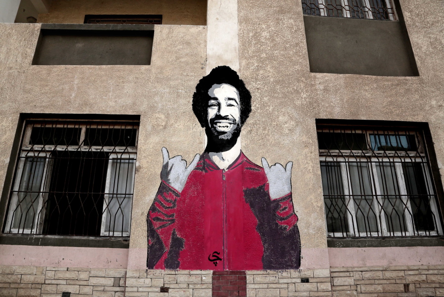 A wall mural of Mohamed Salah at a sports and youth center, in the Nile delta village of Nagrig, Egypt. Residents boast of how the Liverpool winger has poured millions of pounds into the village, with the beneficiaries’ list including a school, a mosque, a youth center and a dialysis machine at a nearby hospital. His success as a footballer in Europe’s most attractive league has inspired many parents in Nagrig to send their children to soccer academies in the hope that maybe one day they can emulate his success.
