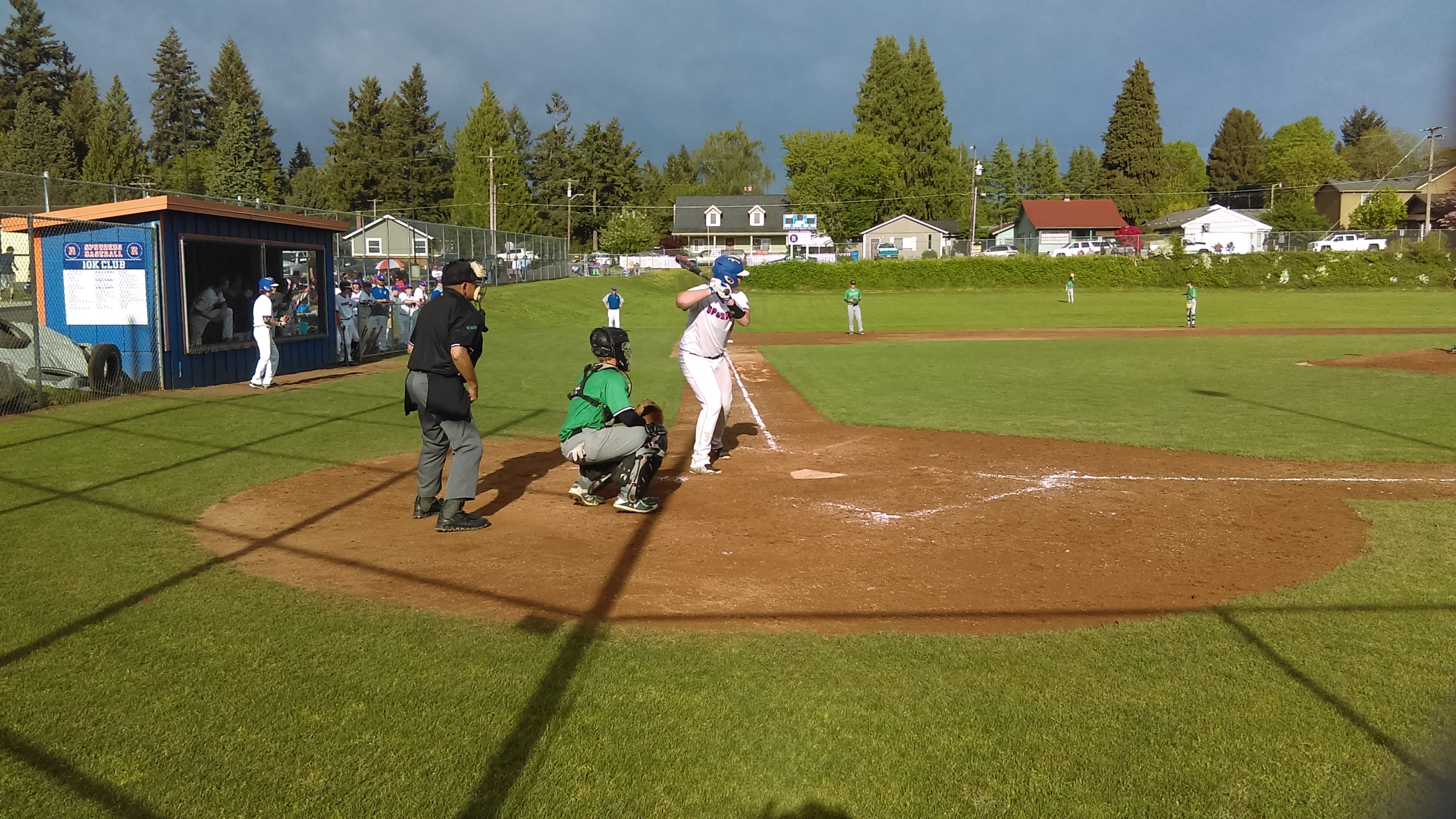 Ridgefield's Brock Harrison stands in the box, awaiting the pitch against Tumwater.