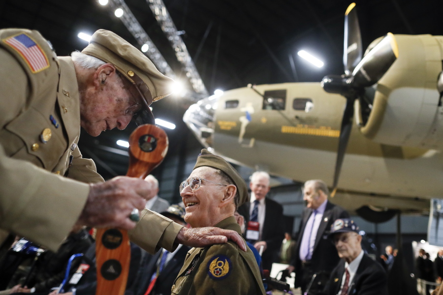 Veterans gather for a private viewing of the Memphis Belle, a Boeing B-17 “Flying Fortress,” at the National Museum of the U.S. Air Force, Wednesday, May 16, 2018, in Dayton, Ohio. The World War II bomber Memphis Belle is set to go on display for the first time since getting a yearslong restoration at the museum. The B-17 “Flying Fortress” will be introduced Thursday morning as the anchor of an extensive exhibit in the Dayton-area museum’s World War II gallery.