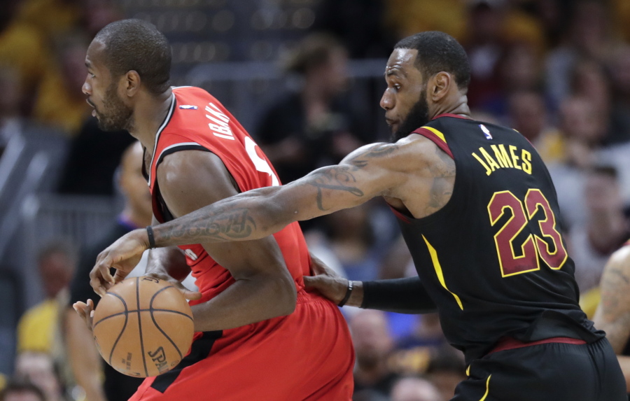 Cleveland Cavaliers’ LeBron James (23) strips the ball from Toronto Raptors’ Serge Ibaka in the first half of Game 4 of an NBA basketball second-round playoff series, Monday, May 7, 2018, in Cleveland.