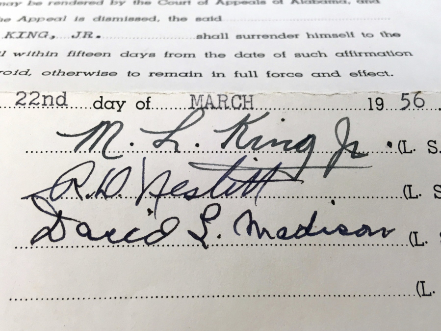 This photo shows the signature of the Rev. Martin Luther King Jr. on a court document in the archive of Alabama State University in Montgomery, Ala. The school is preserving and digitizing historic court documents linked to the civil rights movement that were found in a box at the county courthouse.