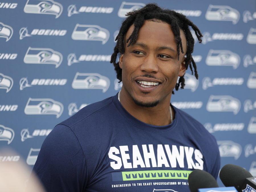 Seattle Seahawks wide receiver Brandon Marshall talks to reporters following NFL football practice, Wednesday, May 30, 2018, in Renton, Wash. (AP Photo/Ted S.