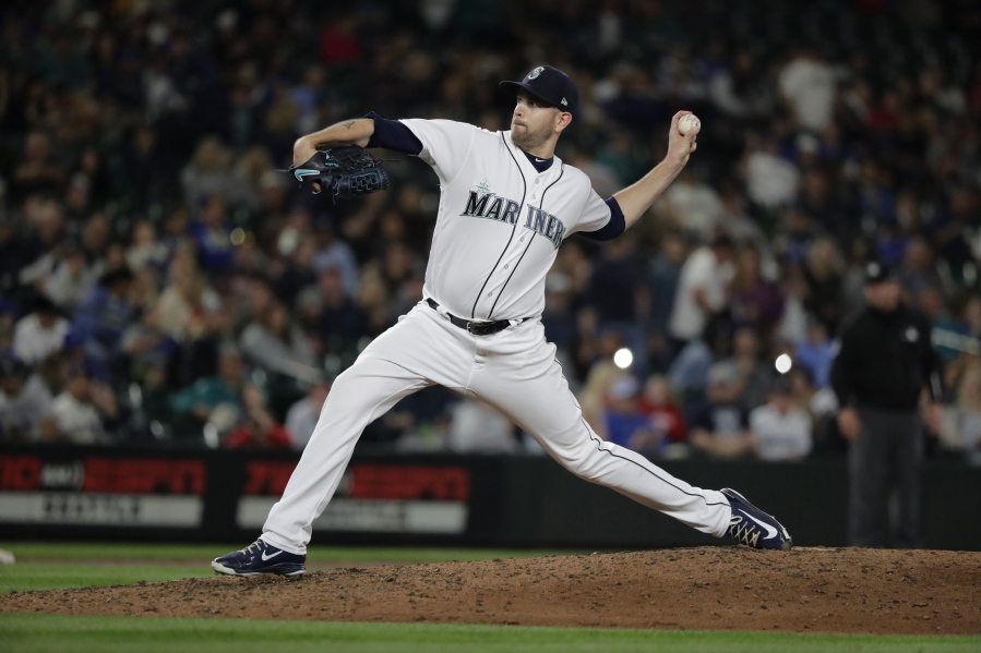Seattle Mariners starting pitcher James Paxton throws to a Detroit Tigers batter during the ninth inning of a baseball game, Saturday, May 19, 2018, in Seattle. Paxton threw a three-hitter as the Mariners won 7-2. (AP Photo/Ted S.