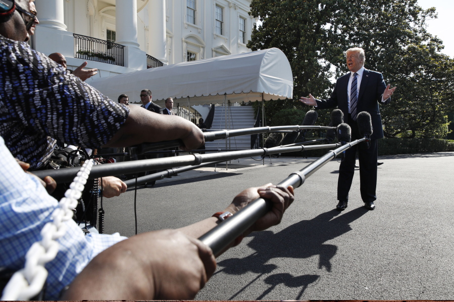 President Donald Trump speaks to the media as he walks to the Marine One helicopter Friday, May 25, 2018, on the South Lawn of the White House in Washington. Trump is traveling to Annapolis, Md., to address the U.S. Naval Academy graduation ceremonies.