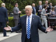 President Donald Trump talks to the media as he leaves for Dallas to address the National Rifle Association, Friday at the White House in Washington.