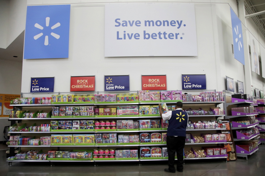 A Walmart employee scans items while conducting an exercise during a Walmart Academy class session at the store in North Bergen, N.J.