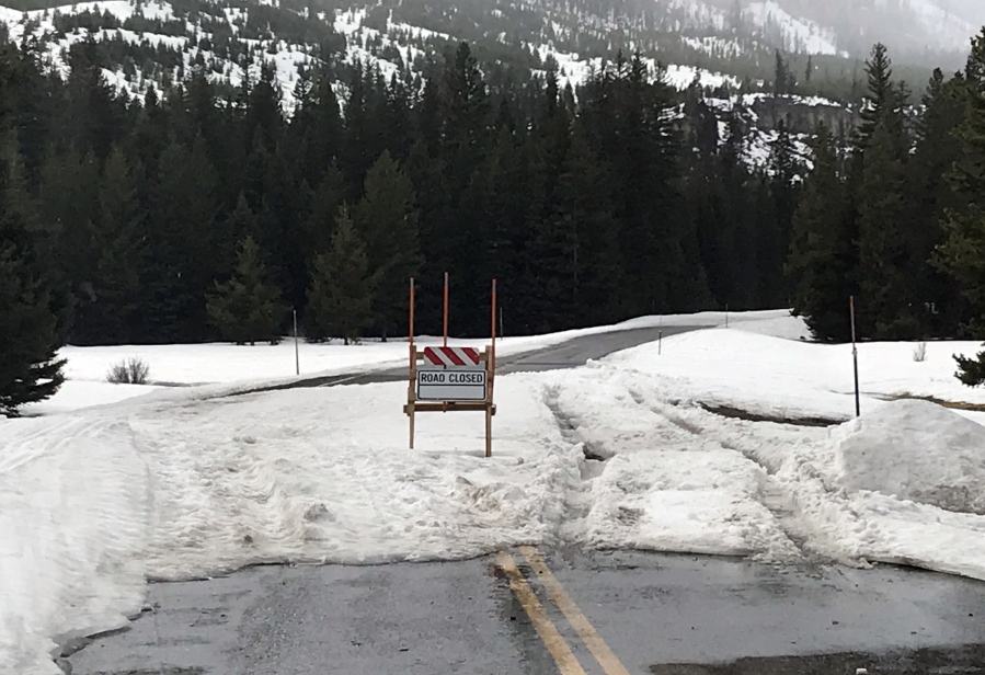 Tire tracks in snow where two men drove past a road-closed sign in northwest Wyoming on Tuesday while trying to get to Yellowstone National Park. The Park County Sheriff’s Office says the men had to be rescued after their Nissan SUV got stuck in snow.
