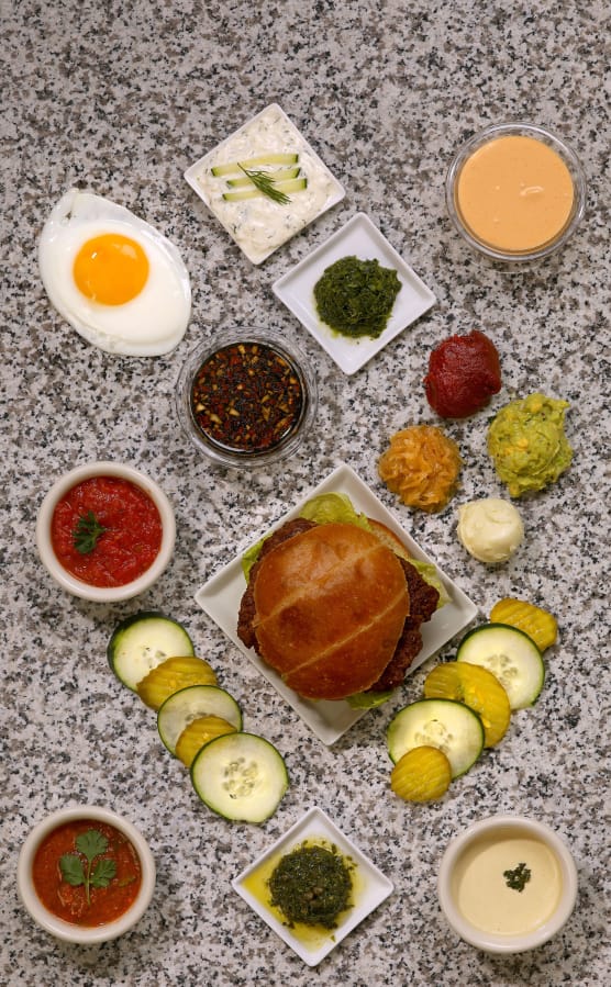 An array of toppings designed to make your burger better. (Christian Gooden/St.