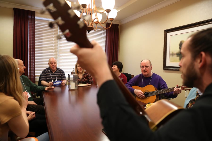 Silverado Memory Care resident Doug Brown, second from right, shows his skills on the guitar during a small session with professional musicians at a 12-week music therapy program for those with dementia and Alzheimer’s on March 31. Brown doesn’t suffer from dementia or Alzheimer’s, but exhibits some of the same memory traits due to having a malignant brain tumor.