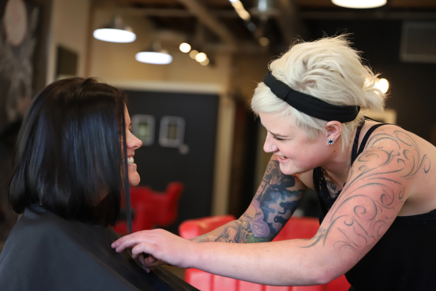As part of the Steller Kindness Project, Katie Steller gives Katie Naughton a complimentary haircut and style.
