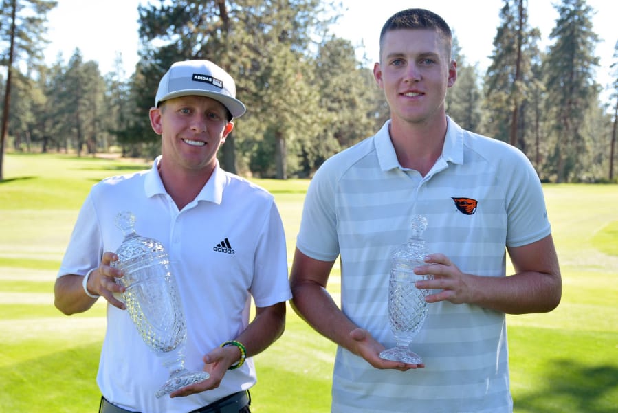 Robbie Ziegler, left, of Portland, and Spencer Tibbits of Vancouver hold their trophies at Bend Golf Club on Saturday, June 23, 2018. Ziegler defeated Tibbits 2 and 1 in the final of the 109th Oregon Amateur Championship.