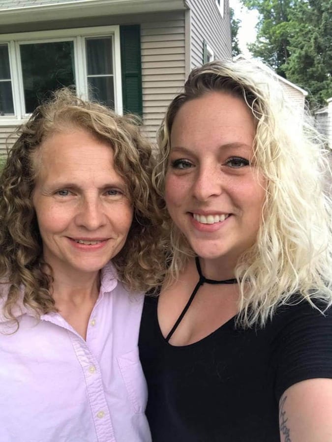Dawn Johnson, left, with her neighbor and long-lost sister Hillary Harris.