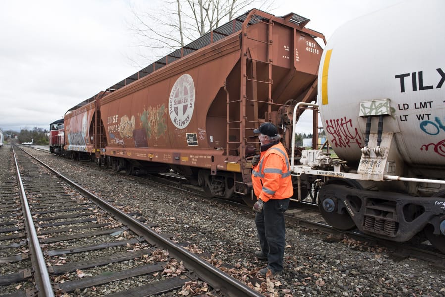 Scott Marshall of Vancouver, engineer and conductor with Portland Vancouver Junction Railroad, switches inbound rail cars at Rye Yard in January.
