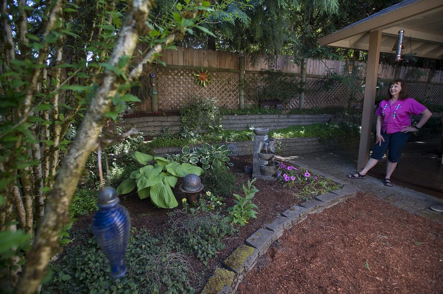 Diane Stevens’ garden at her Salmon Creek home features a number of recycled items that she has transformed into artwork.