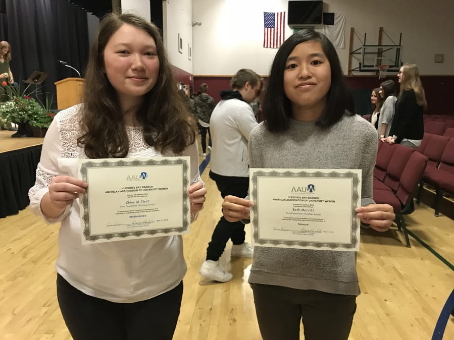 Battle Ground: Firm Foundation Christian School sophomores Beth Merritt, left, and Chloe Neet received Scholar Recognitions by the Hudson’s Bay branch of the American Association of University Women for their achievement in math and science.