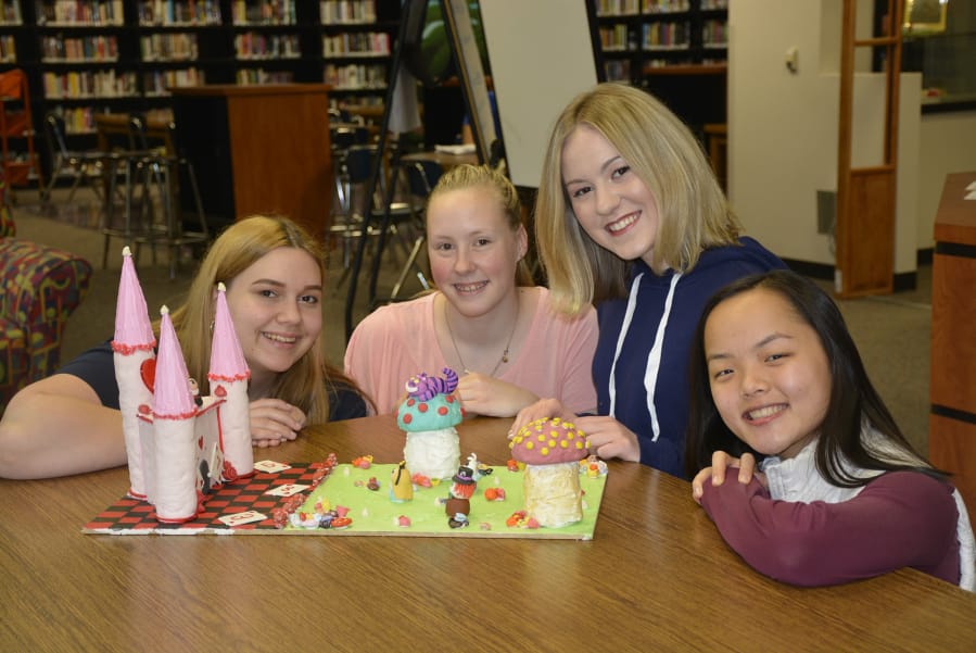 Washougal: Washougal High School advanced baking students created book-themed cakes in honor of National Library Week. Rose Elsensohn, from left, Rebecca McDonald, Hannah Moen and Jennifer Whitmeyer baked an “Alice in Wonderland” cake, which students at the school voted as their favorite.