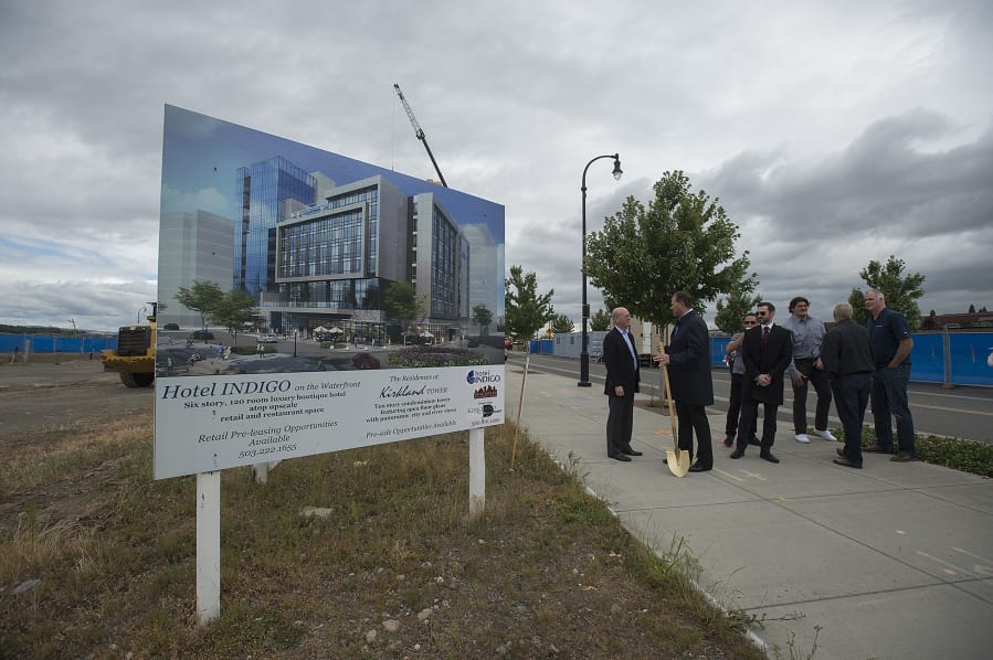 Dean Kirkland, second from left, chats with colleagues and supporters after the groundbreaking of Hotel Indigo and Kirkland Tower. The two buildings will be the sixth and seventh buildings at The Waterfront Vancouver.