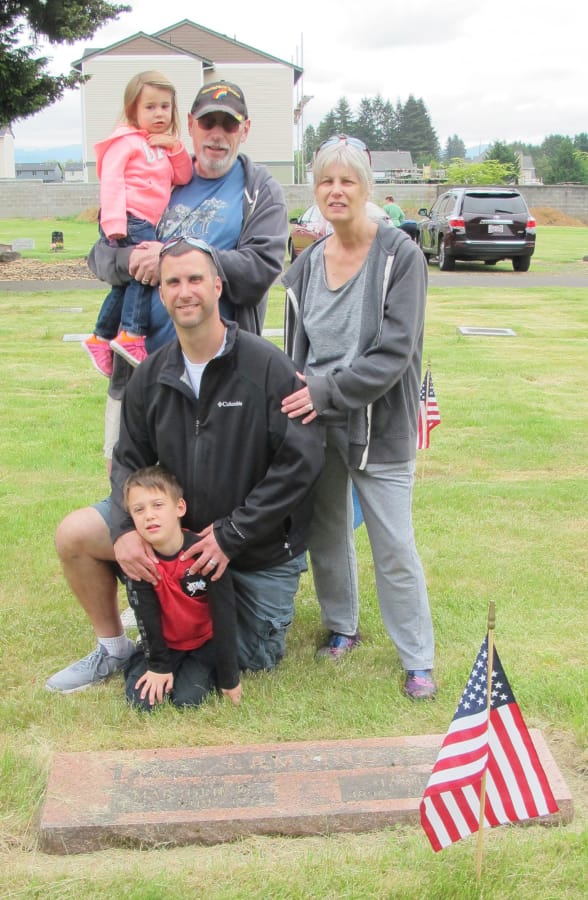 Brush Prairie: Fort Vancouver Daughter of the American Revolution member Cathy Zweig, right, with her family at an event where the organization put flags at the graves of veterans at Brush Prairie Cemetery.