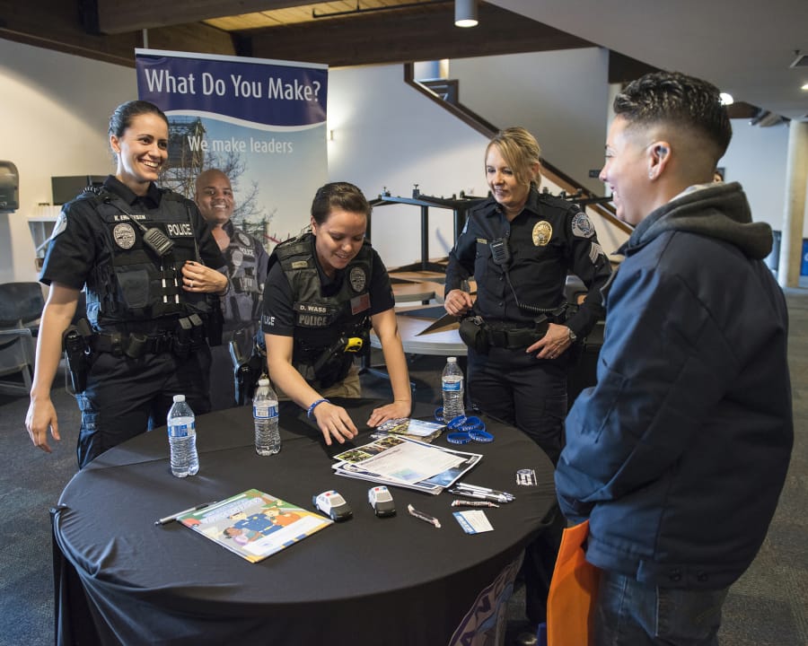 Officer Katie Endresen, Officer Danielle Wass and Sgt. Barb Kipp of the Vancouver Police Department share information about the police force April 28 at the Women In Law Enforcement Career Fair at the state Criminal Justice Training Center in Burien.