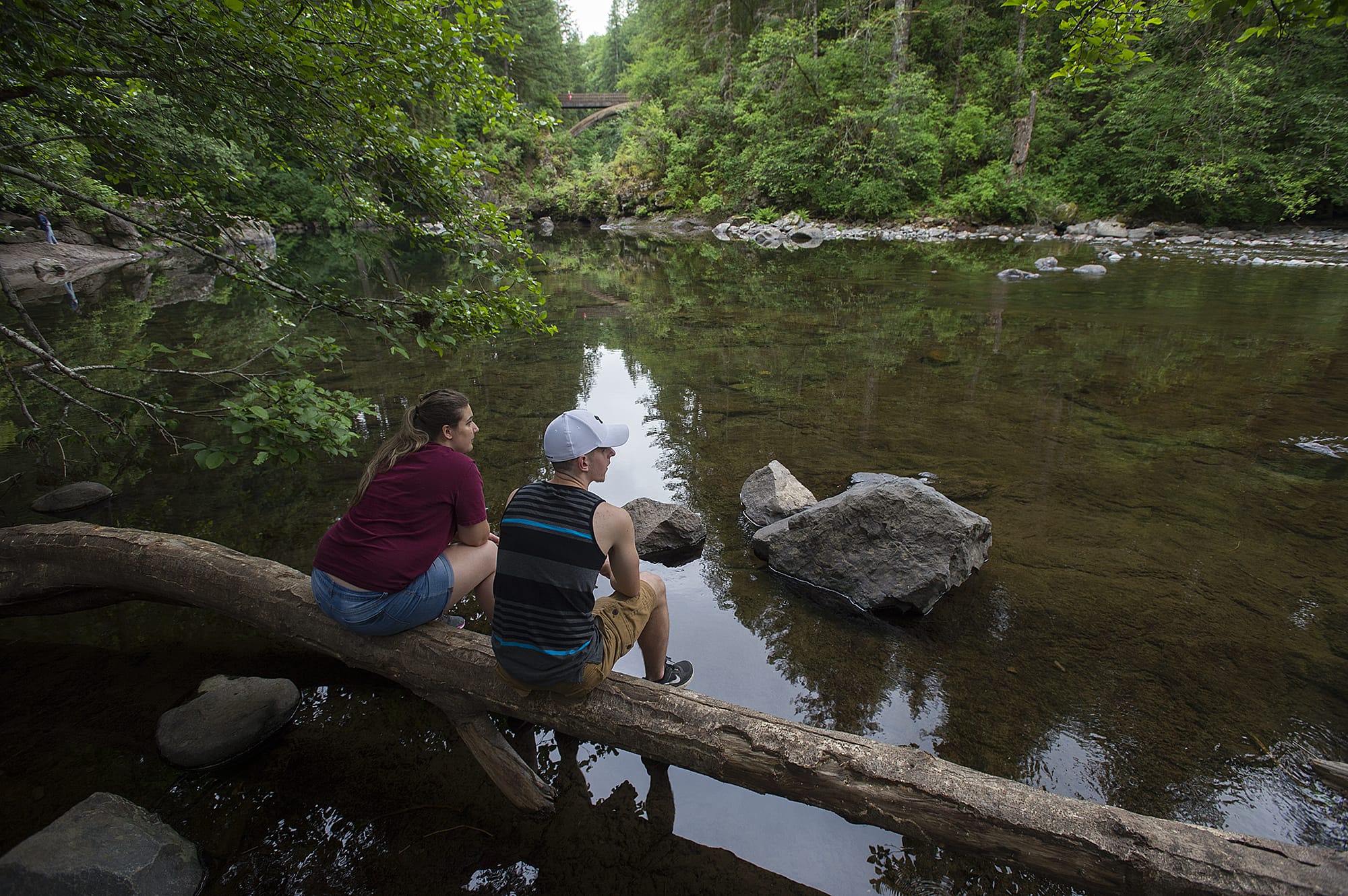 Noaa Boris, left, and Connor Guenther, both of Battle Ground, take in the view as rocks are exposed by low water levels near Moulton Falls Park on Thursday afternoon, June 21, 2018.