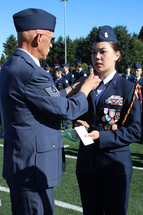 Brush Prairie: Prairie High School Air Force Junior Reserve Officer Training Corps Group Commander Cadet Lt. Col. Heather Lee receiving her new ranks from her grandfather, Master Sgt. Charles A. Bowers, who is retired from the United States Air Force.