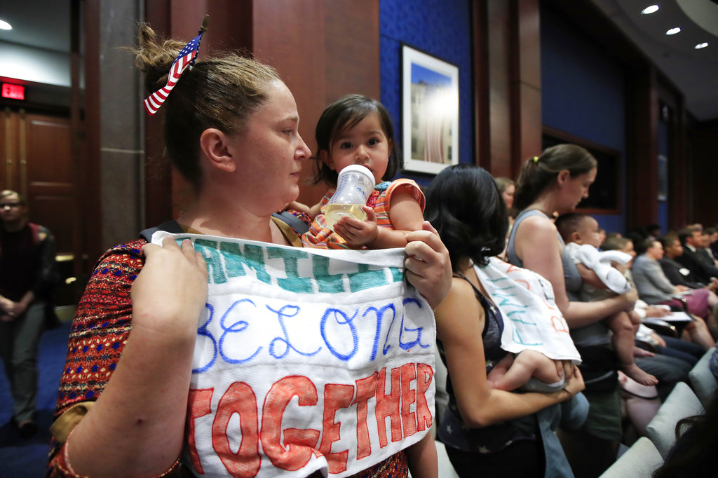 Lucy Martin and her daughter Branwen Espinal together with other mothers and their babies, attend a House Committee on the Judiciary and House Committee on Oversight and Government Reform hearing, to express their support and sympathy to immigrants and their families and objection to the forced separation of migrant children from their parents, on Capitol Hill in Washington, Tuesday, June 19, 2018.
