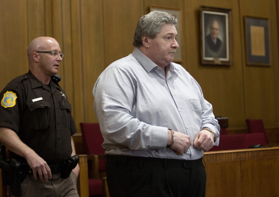 Charles Pickett Jr., of battle Creek, Mich., enters a courtroom in Kalamazoo moments before 14 counts of “guilty” are read as the verdict in his murder trial for the deaths of five bicyclists and severe injuries to four others stemming from the June 7, 2016 crash on a rural road in Cooper Township, Mich. Pickett is scheduled to be sentenced Monday, June 11, 2018.
