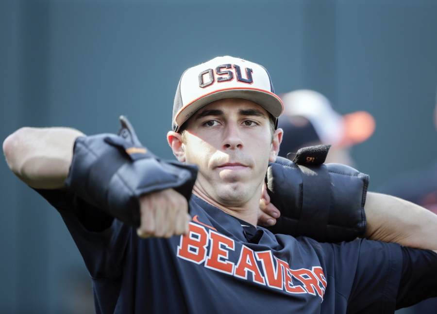 Oregon State pitcher Luke Heimlich works with weights during practice at TD Ameritrade Park in Omaha, Neb., Friday, June 15, 2018. Oregon State plays North Carolina on Saturday in the NCAA College World Series baseball tournament..