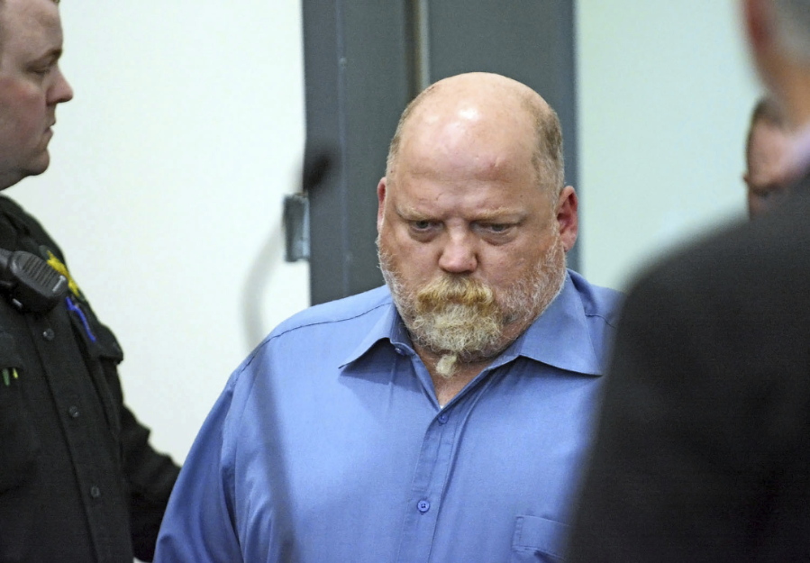 FILE - In this Friday, May 18, 2018, file photo, William Earl Talbott II enters the courtroom at the Skagit County Community Justice Center before entering a plea of not guilty for the 1987 murder of Tanya Van Cuylenborg in Mount Vernon, Wash. A Washington state man authorities say is linked by DNA evidence to the 1987 deaths of a young Canadian couple has been charged with two counts of aggravated first-degree murder. The Daily Herald reports that 55-year-old William Earl Talbott II of SeaTac was charged Friday, June 15, 2018, in Snohomish County Superior Court. Authorities say they used information from public genealogy websites to pinpoint Talbott as a suspect, then arrested him after getting a DNA sample from a cup that fell from his vehicle.