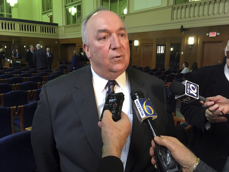 Michigan State University’s interim president John Engler speaks with reporters after appearing at a legislative hearing in Lansing, Mich. A letter signed by at least 120 victims sexual abuse by former sports doctor Larry Nassar on Tuesday, June 19, urged Michigan State University’s governing board to oust Engler, saying he had reinforced a “culture of abuse” at the school.