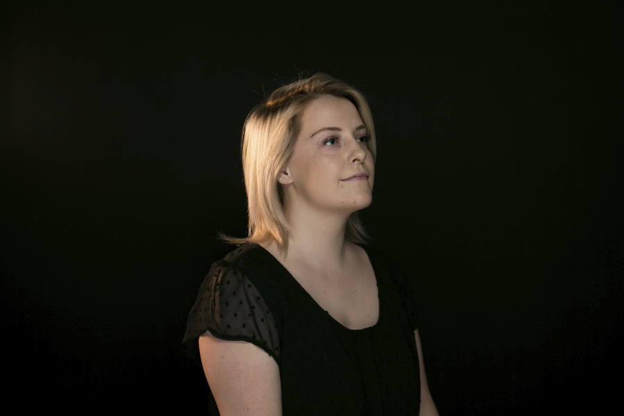 In this Friday, June 15, 2018, photo, Kori Haubrich, 23, poses for a portrait at the studio of the newspaper in Yakima, Wash. When Haubrich was in her late teens, she was diagnosed with depression, anxiety and obsessive-compulsive disorder. She began taking medication but stopped after two years, believing she no longer needed it. About a month later, she attempted to kill herself. Two years after her attempt, Haubrich calls herself a survivor.