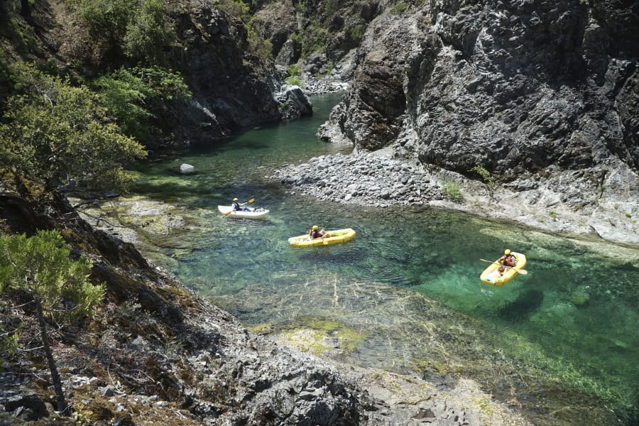 In a June 2018 photo, kayakers paddle through the Magic Canyon of the Chetco River. The National Wild and Scenic Rivers Act turns 50 this year.